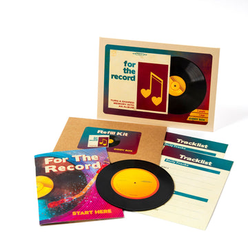 A photo of the For the Record date night kit, showing the main envelope, the guide booklet, two tracklist cards, the vinyl record keepsake, and a smaller envelope titled "refill kit."