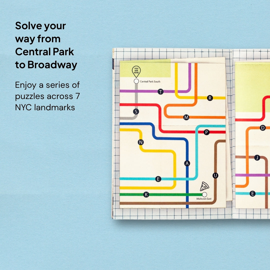 The guide booklet from New York for Two, open to a spread with two NYC subway maps, set on a light blue background. The graphic is labelled: "Solve your way from Central Park to Broadway: Enjoy a series of puzzles across 7 NYC landmarks."